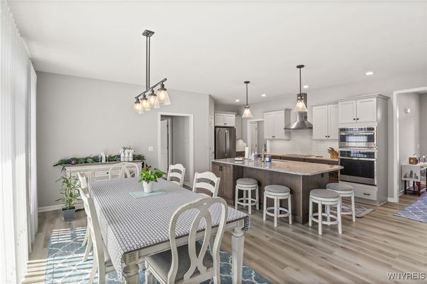 Dining room, Interior, Kitchen, Pendant Lights, Recessed Lighting, Stainless Steel Appliances, Wood Texture Flooring