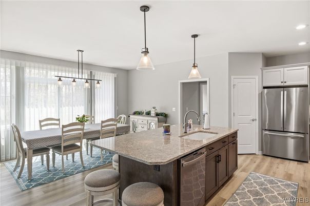 Dining room, Interior, Kitchen, Pendant Lights, Recessed Lighting, Stainless Steel Appliances, Wood Texture Flooring