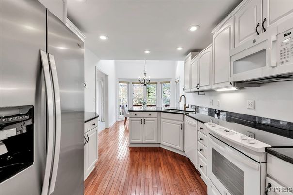 Chandelier, Interior, Kitchen, Recessed Lighting, Stainless Steel Appliances, Wood Texture Flooring