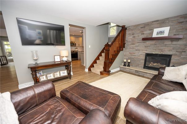 Fireplace, Interior, Kitchen, Living room, Recessed Lighting, Stone Walls, Wood Texture Flooring
