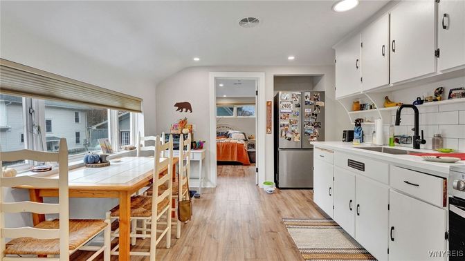 Interior, Kitchen, Recessed Lighting, Tile Countertops, Wood Texture Flooring