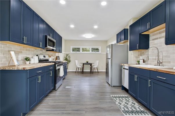 Dining room, Interior, Kitchen, Recessed Lighting, Stainless Steel Appliances, Wood Texture Flooring