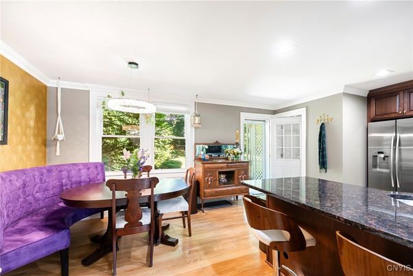 Chandelier, Dining room, Interior, Kitchen, Pendant Lights, Recessed Lighting, Stainless Steel Appliances, Wood Texture Flooring