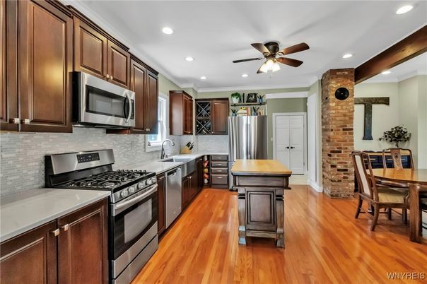 Dining room, Interior, Kitchen, Recessed Lighting, Stainless Steel Appliances, Stone Walls, Wood Texture Flooring
