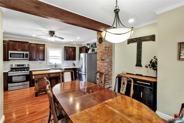 Dining room, Interior, Kitchen, Pendant Lights, Recessed Lighting, Stainless Steel Appliances, Stone Walls, Wood Texture Flooring