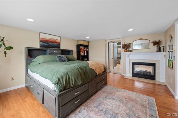 Bedroom, Fireplace, Interior, Recessed Lighting, Wood Texture Flooring