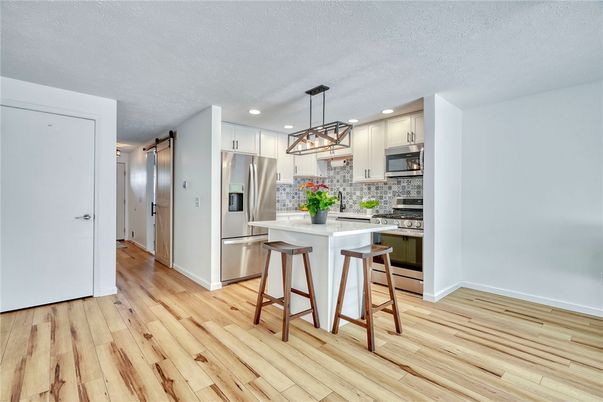 Interior, Kitchen, Pendant Lights, Recessed Lighting, Stainless Steel Appliances, Wood Texture Flooring