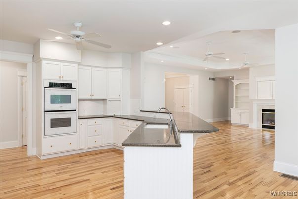 Fireplace, Interior, Kitchen, Recessed Lighting, Wood Texture Flooring
