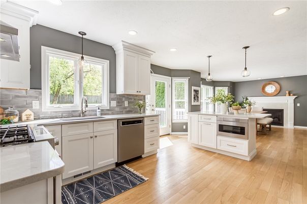 Dining room, Fireplace, Interior, Kitchen, Pendant Lights, Recessed Lighting, Stainless Steel Appliances, Wood Texture Flooring