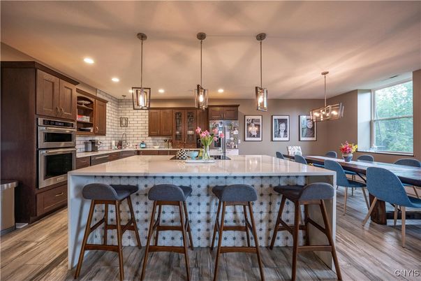Dining room, Interior, Kitchen, Pendant Lights, Recessed Lighting, Stainless Steel Appliances, Wood Texture Flooring