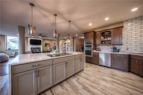 Fireplace, Interior, Kitchen, Pendant Lights, Recessed Lighting, Stainless Steel Appliances, Wood Texture Flooring