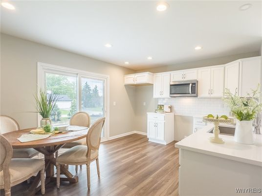 Dining room, Interior, Kitchen, Recessed Lighting, Stainless Steel Appliances, Wood Texture Flooring