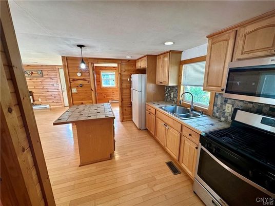 Interior, Kitchen, Pendant Lights, Recessed Lighting, Tile Countertops, Wood Texture Flooring, Wooden Walls