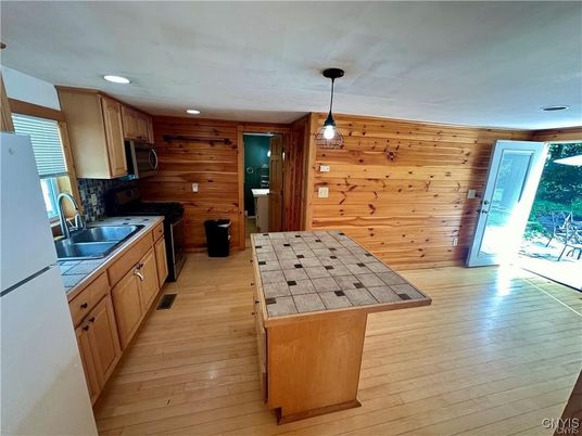 Interior, Kitchen, Pendant Lights, Recessed Lighting, Tile Countertops, Wood Texture Flooring, Wooden Walls