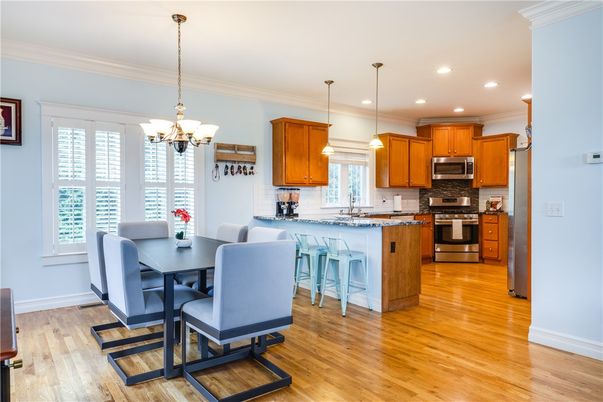 Chandelier, Dining room, Interior, Kitchen, Pendant Lights, Recessed Lighting, Stainless Steel Appliances, Wood Texture Flooring