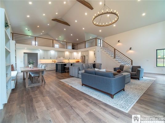 Chandelier, Dining room, Interior, Kitchen, Living room, Pendant Lights, Recessed Lighting, Wooden Beams, Wood Texture Flooring