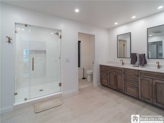 Bathroom, Dual Sink Vanities, Glass Shower, Interior, Recessed Lighting, Wood Texture Flooring