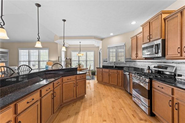 Dining room, Interior, Kitchen, Pendant Lights, Recessed Lighting, Stainless Steel Appliances, Wood Texture Flooring