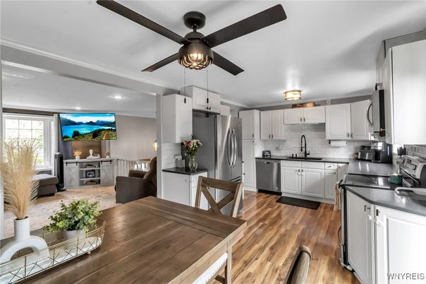 Dining room, Interior, Kitchen, Recessed Lighting, Stainless Steel Appliances, Wood Texture Flooring