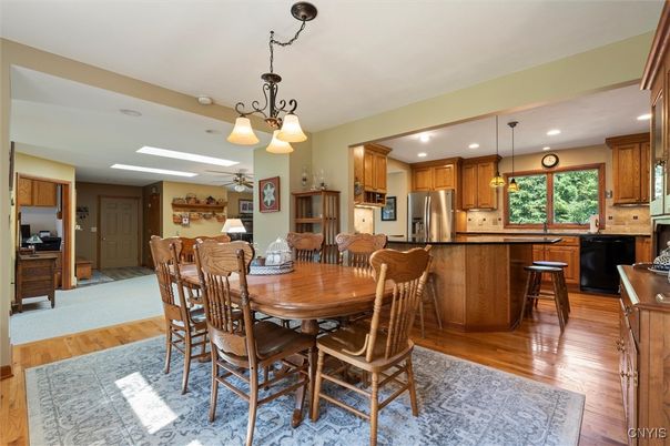 Dining room, Interior, Kitchen, Pendant Lights, Recessed Lighting, Stainless Steel Appliances, Wood Texture Flooring