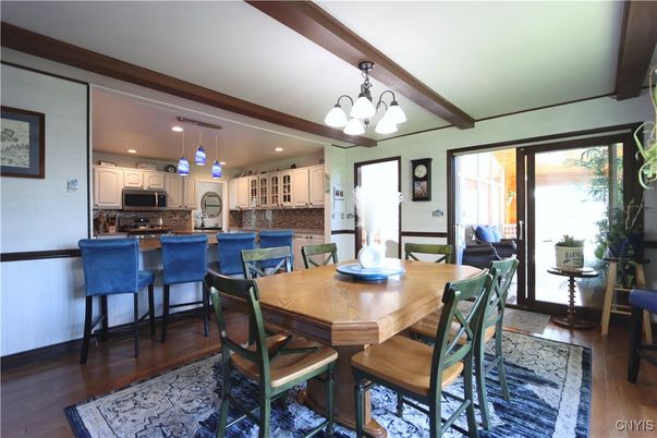 Chandelier, Dining room, Interior, Kitchen, Pendant Lights, Recessed Lighting, Stainless Steel Appliances, Wooden Beams, Wood Texture Flooring