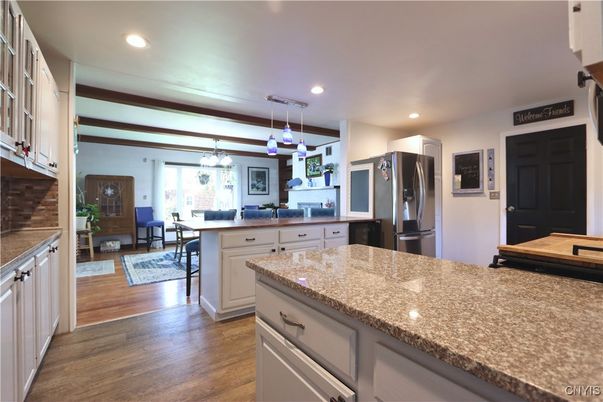 Dining room, Interior, Kitchen, Pendant Lights, Recessed Lighting, Stainless Steel Appliances, Wood Texture Flooring