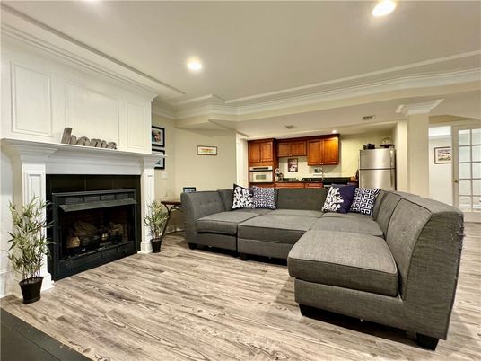 Fireplace, Interior, Kitchen, Living room, Recessed Lighting, Stainless Steel Appliances, Wood Texture Flooring