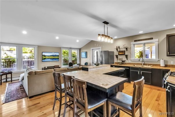 Dining room, Interior, Kitchen, Living room, Pendant Lights, Recessed Lighting, Stainless Steel Appliances, Wood Texture Flooring