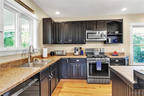 Interior, Kitchen, Recessed Lighting, Stainless Steel Appliances, Tile Countertops, Wood Texture Flooring