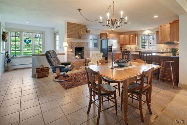 Chandelier, Dining room, Fireplace, Interior, Kitchen, Living room, Recessed Lighting, Stainless Steel Appliances, Stone Walls