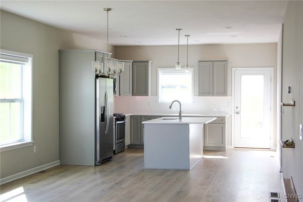 Chandelier, Interior, Kitchen, Pendant Lights, Recessed Lighting, Stainless Steel Appliances, Wood Texture Flooring