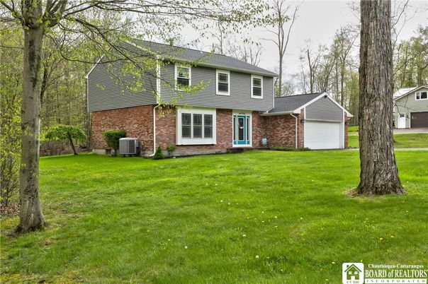 Attached, Backyard, Exterior, Facade, Brick Facade, Split Level