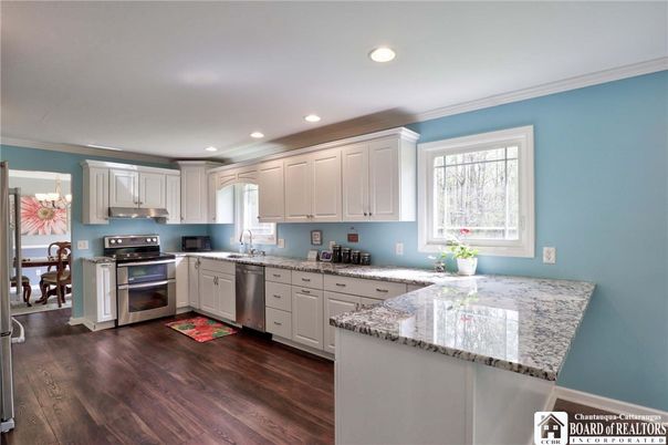 Dining room, Interior, Kitchen, Recessed Lighting, Stainless Steel Appliances, Wood Texture Flooring