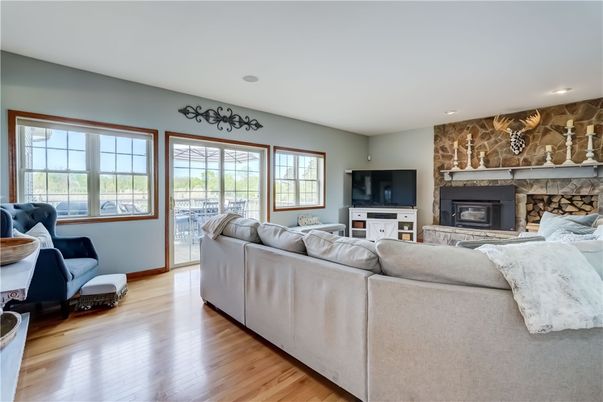 Fireplace, Interior, Living room, Recessed Lighting, Stone Walls, Wood Texture Flooring