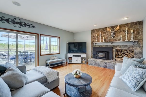 Fireplace, Interior, Living room, Recessed Lighting, Stone Walls, Wood Texture Flooring