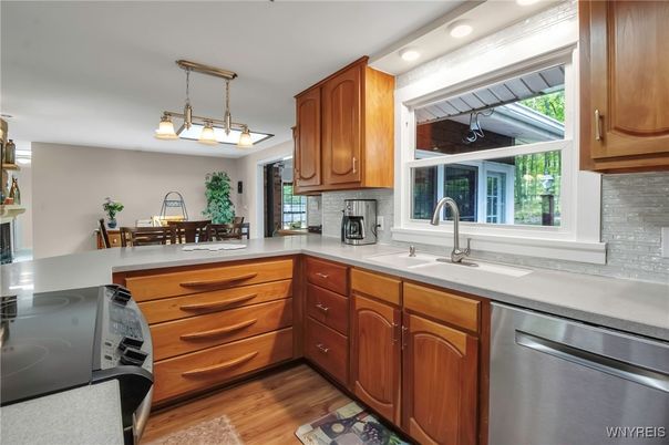 Dining room, Interior, Kitchen, Pendant Lights, Recessed Lighting, Stainless Steel Appliances, Wood Texture Flooring