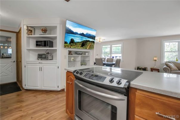 Chandelier, Dining room, Interior, Kitchen, Stainless Steel Appliances, Wood Texture Flooring