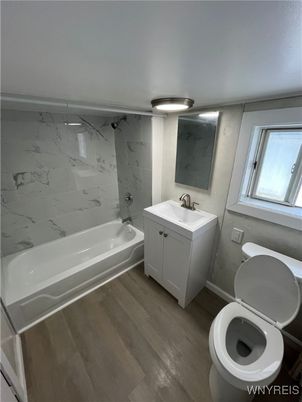 Bathroom, Dual Sink Vanities, Interior, Marble Walls, Wood Texture Flooring