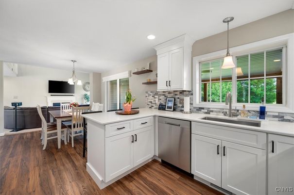 Dining room, Interior, Kitchen, Pendant Lights, Recessed Lighting, Stainless Steel Appliances, Wood Texture Flooring