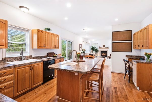 Dining room, Fireplace, Interior, Kitchen, Recessed Lighting, Wood Texture Flooring