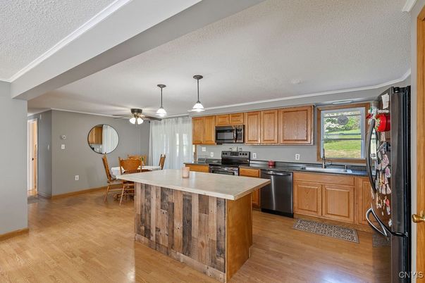 Dining room, Interior, Kitchen, Pendant Lights, Stainless Steel Appliances, Wood Texture Flooring