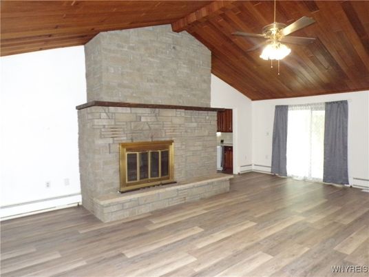 Empty room, Fireplace, Interior, Stone Walls, Wooden Ceilings, Wood Texture Flooring