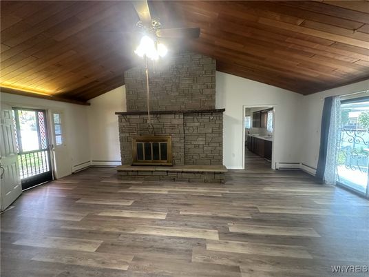 Empty room, Fireplace, Interior, Stone Walls, Wooden Ceilings, Wood Texture Flooring