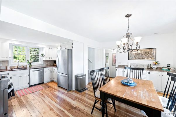 Chandelier, Dining room, Interior, Kitchen, Stainless Steel Appliances, Wood Texture Flooring