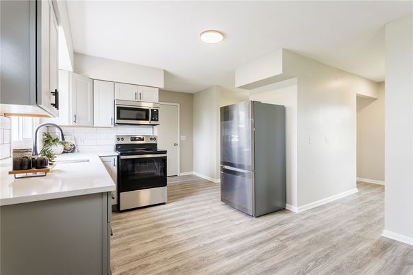 Interior, Kitchen, Recessed Lighting, Stainless Steel Appliances, Wood Texture Flooring