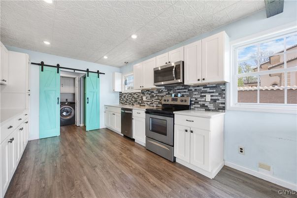 Interior, Kitchen, Recessed Lighting, Stainless Steel Appliances, Washer, Wood Texture Flooring