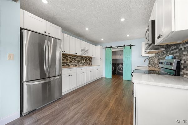 Interior, Kitchen, Recessed Lighting, Stainless Steel Appliances, Washer, Wood Texture Flooring