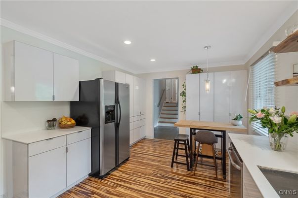 Dining room, Interior, Kitchen, Pendant Lights, Recessed Lighting, Stainless Steel Appliances, Wood Texture Flooring