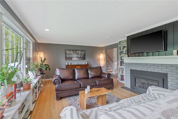Fireplace, Interior, Living room, Recessed Lighting, Wood Texture Flooring