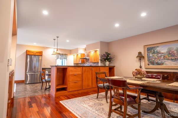 Dining room, Interior, Kitchen, Pendant Lights, Recessed Lighting, Stainless Steel Appliances, Wood Texture Flooring
